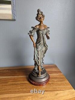 Beautiful sculpture of a woman in Art Nouveau style