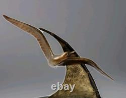 Bronze sculpture signed Elise Guy Art Deco Seagull in Full Flight in front of a Sail