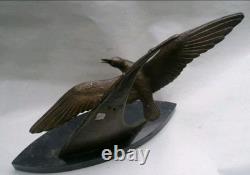 Bronze sculpture signed Elise Guy Art Deco Seagull in Full Flight in front of a Sail