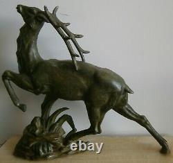 Sculpture animalière Art déco 1930 Cerf en régule patine vert bronze antique
