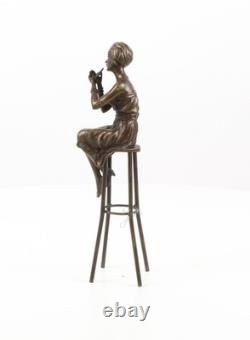 Sculpture d'une Dame sur barchair Art déco en bronze d'après Demetre Chiparus